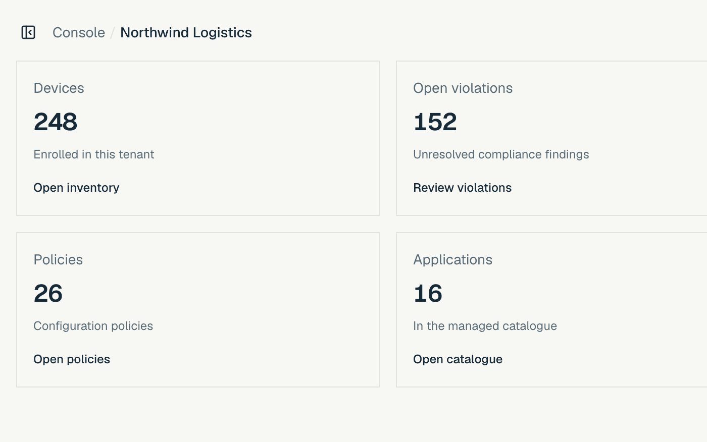 The console overview on the light theme: 248 devices enrolled, 152 open violations, 26 policies and 16 applications.